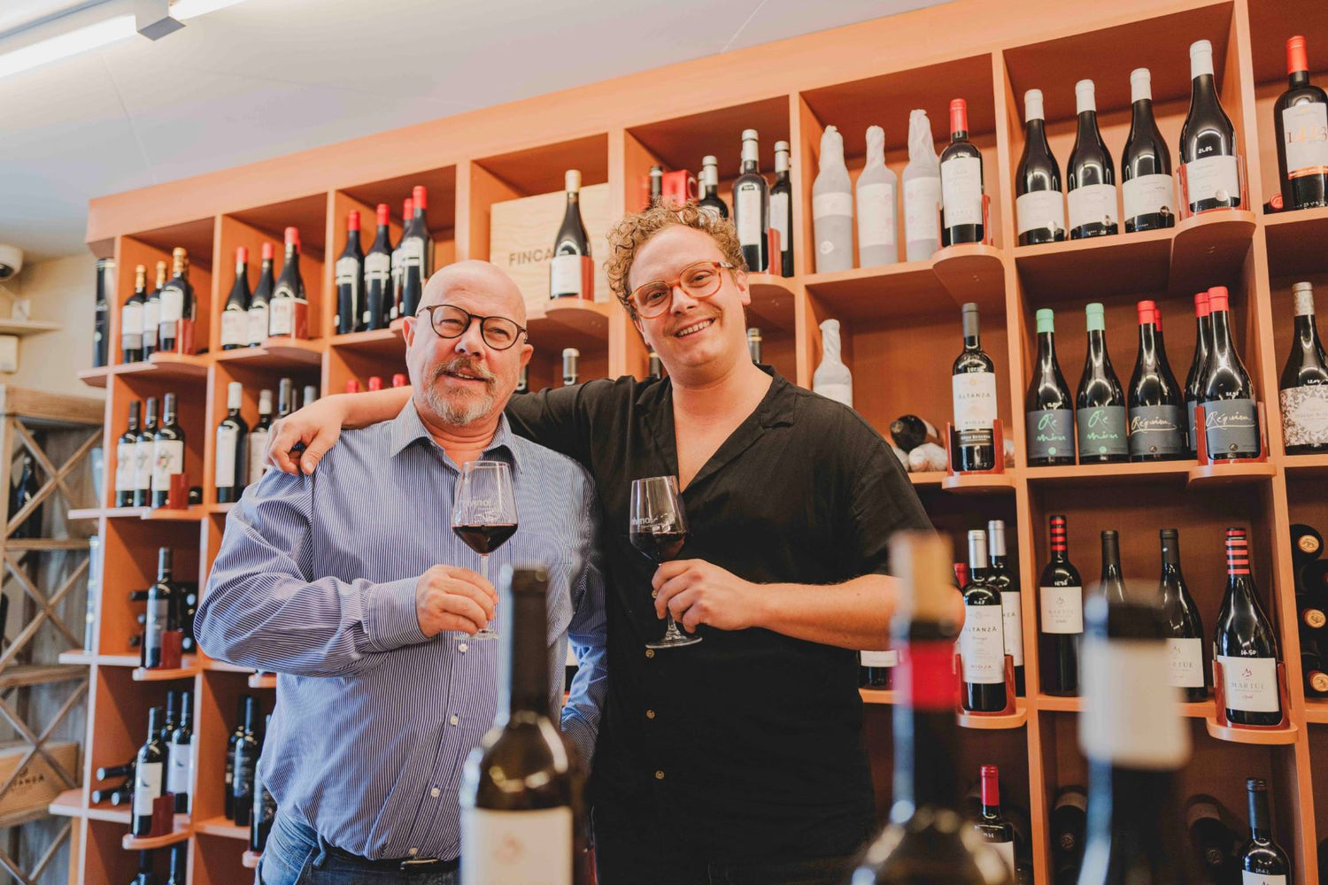 Guy and Tom pose for a picture in the wine store